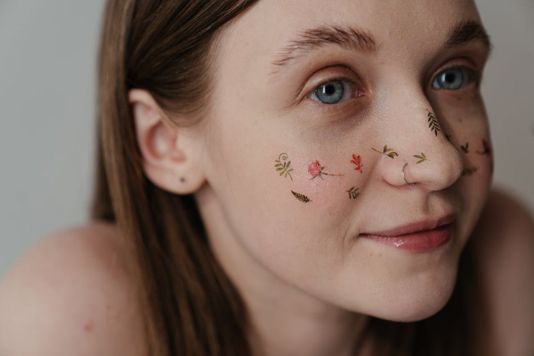 girl with temporary tattoos on the face