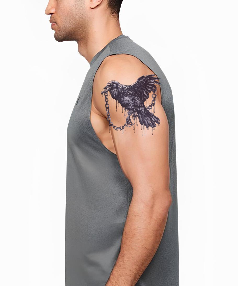 Raven in Chains with Red Accent Tattoo Idea