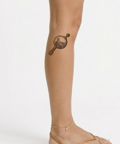 Surreal Magnifying Glass Tattoo Design