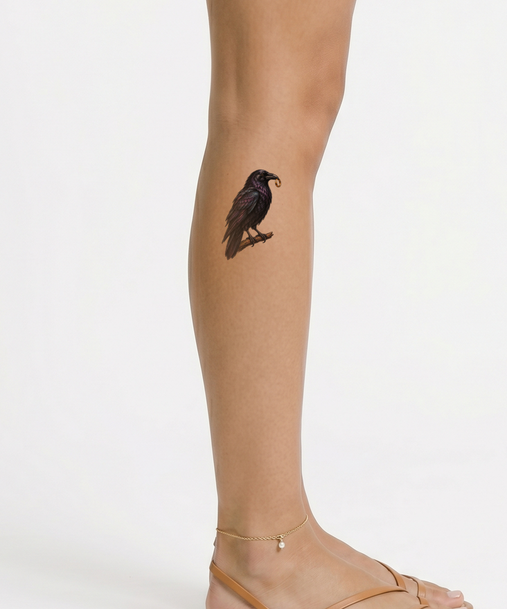 Raven with a Gold Ring in Its Beak Tattoo Design