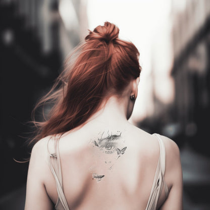 Mysteriöse Frau mit Schmetterling Tattoo-Design